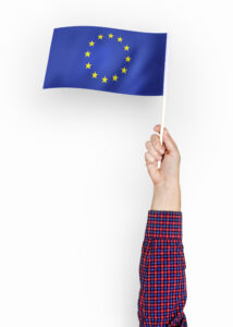 Diagram showing EU AI Act four-tier risk classification system from minimal to unacceptable risk with compliance requirements for high-risk AI systems