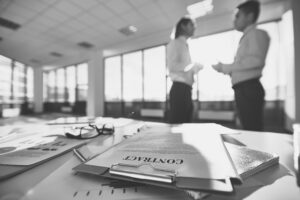 Concept of conflict checking, showing a professional examining files to ensure no conflicts of interest.