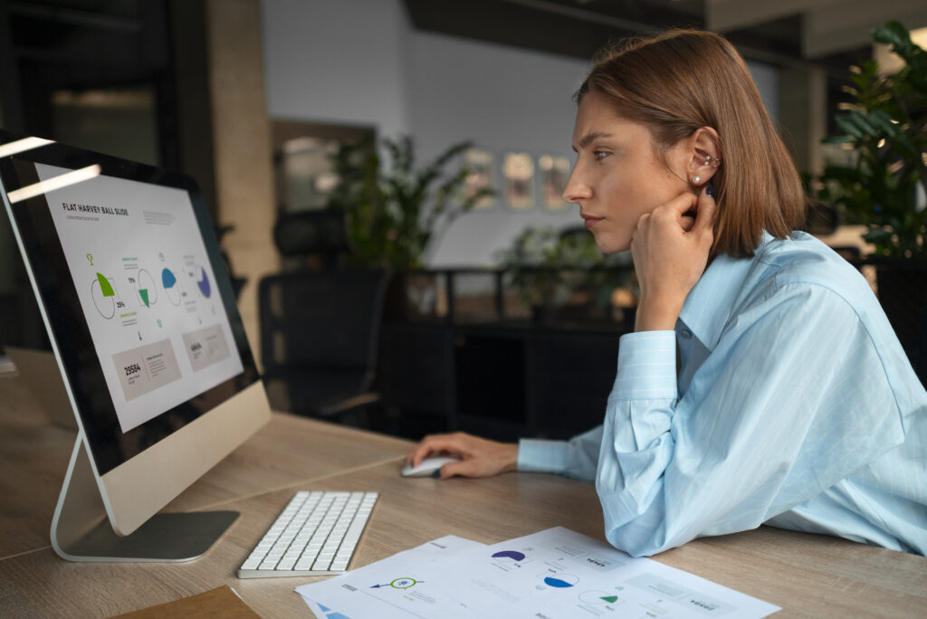 KYC analyst reviewing documents with AI software in a bank