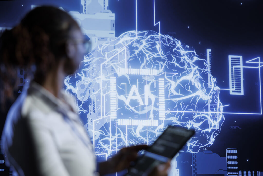 Professional woman viewing screen with AI interface representing agentic AI in RegTech for compliance and risk detection